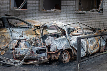 Dnepr, Ukraine – January 6: Russian drones attacked the Dnieper. Burnt and damaged cars in the Dnieper. Utility services clean up the aftermath of the attack on the city.