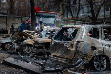 Fototapeta na wymiar Dnepr, Ukraine – January 6: Russian drones attacked the Dnieper. Burnt and damaged cars in the Dnieper. Utility services clean up the aftermath of the attack on the city.