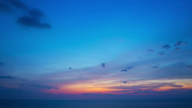 Aerial hyperlapse sweet sky cloud scape in colorful sunset.
colorful light through to the cloud above the ocean.
Scene of Colorful romantic sky sunset background.