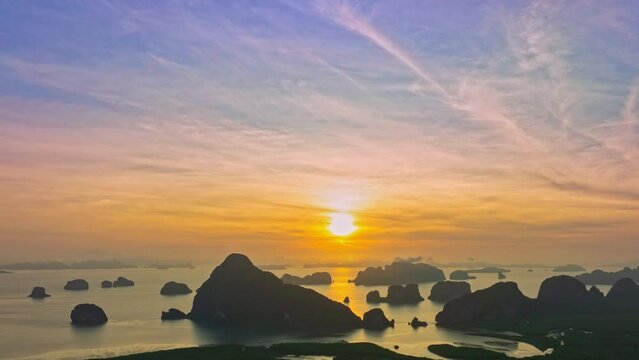 aerial Hyperlapse view High peaks wonderful pink sky at sunrise.above Samed Nang Chee viewpoint in Phang Nga. .tropical landscape background.