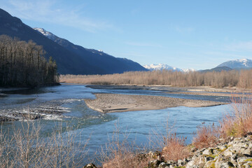 Beautiful view of the Squamish River during a fall season at the Brackendale Eagle Run vista point in Squamish, British Columbia, Canada