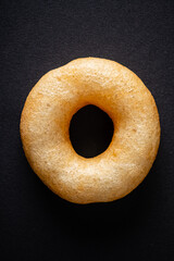 donut with sugar on the black background