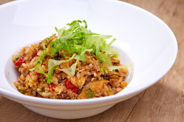 fried rice with vegetables on white plate