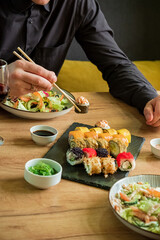 couple eating sashimi in the restaurant © Maksim Shebeko