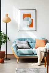 Blue sofa in a living room with a geometric artwork on the wall