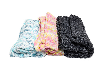 Fototapeta premium Knitted warm blankets on a white background. Handmade woven soft blankets. Texture of colored yarn.