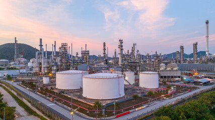 Oil and gas industrial refinery at twilight, Oil refinery and Petrochemical plant pipeline steel,...