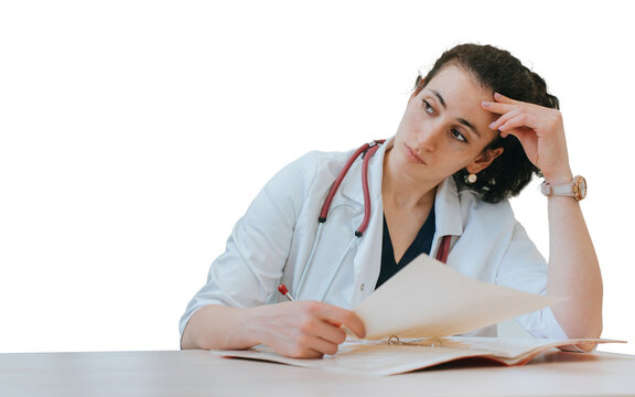 Tired doctor sitting at desk thoughtfully looks away holds diagnosis of patient. Upset medical employee at against transparent background. Exhausted nurse