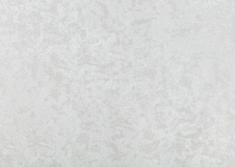 The texture of white paper wallpaper is white with textured chaotic gray small spots.