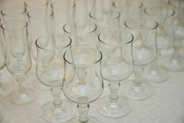The setting of the festive table. Festive glasses for drinks.
