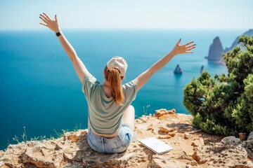 Woman tourist sky sea. Happy traveller woman in hat enjoys vacation raised her hands up