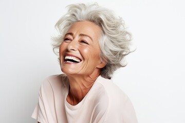 Close up portrait of a happy senior woman laughing isolated on white background - obrazy, fototapety, plakaty