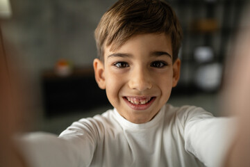One boy caucasian child seven years old kid at home schoolboy portrait