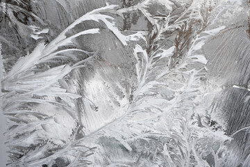 Frosty pattern on glass on frosty winter day
