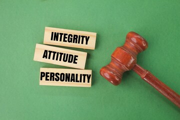 judge's gavel and stick with the words integrity, attitude and personality. the concept of...
