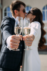 A man and woman holding wine glasses at a wedding or formal event 5155.