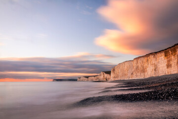 January sunset high tide at Birling gap and the seven sisters cliffs on the east Sussex coast south east England UK