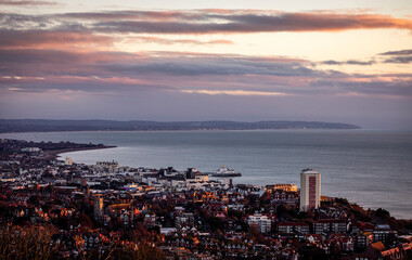January sunrise from Beachy head over the coastal town of Eastbourne on the east Sussex coast south east England UK