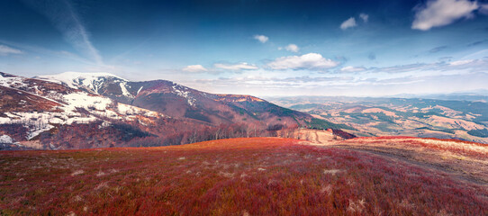 April in mountains. Red hills of Borzhava ridge. Panoramic spring view of Carpathian moiuntains...