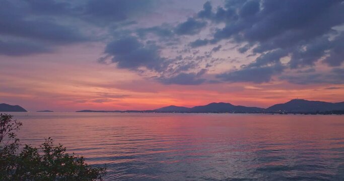 aerial view reflection of colorful cloud in bright sky of sunset above the ocean at Khao Khad Phuket. 
Majestic sunset or sunrise landscape Amazing light of nature background. 
fantastic sky texture.