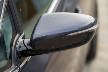 Left outside gray rearview mirror with turn signal.