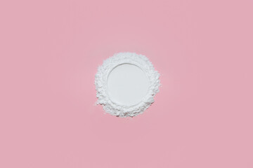 Clear white face powder with an empty circle on a soft pastel pink background, designed as a...