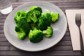 Diet food. steamed broccoli on plate