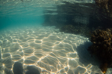 Light pattern on the sandy ocean floor.