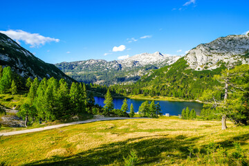 Großsee on the high plateau of the Tauplitzalm. View of the lake at the Toten Gebirge in Styria. Idyllic landscape with mountains and a lake on the Tauplitz.
