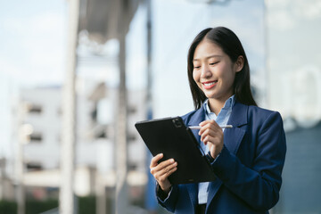 Email notification concept, Business woman use Tablet and laptop receive message alert in the mailbox.