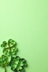 St patricks day background with clover paper cut art on green background.