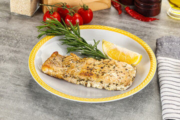 Baked salmon fish served rosemary