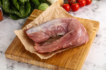 Uncooked raw pork tenderloin with spices