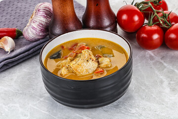 Traditional yellow Thai curry with chicken