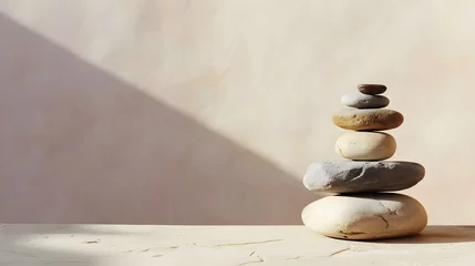 Fototapete Spa, balance, meditation and zen minimal modern concept. Stack of stone pebbles against beige wall for design and presentation. © PSCL RDL