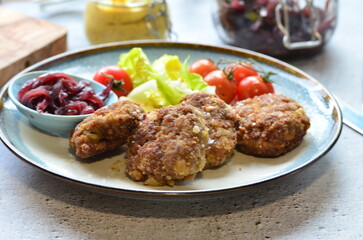 a traditional Czech dish of fried meatballs, minced meat with vegetables,