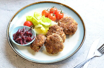 a traditional Czech dish of fried meatballs, minced meat with vegetables,