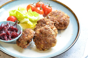 a traditional Czech dish of fried meatballs, minced meat with vegetables,