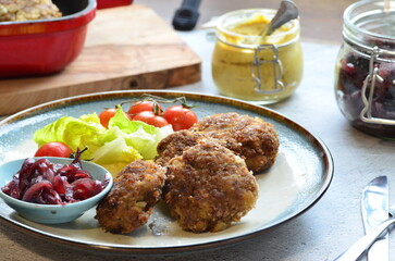 Fried meatballs with vegetables on the table. Selective focus.