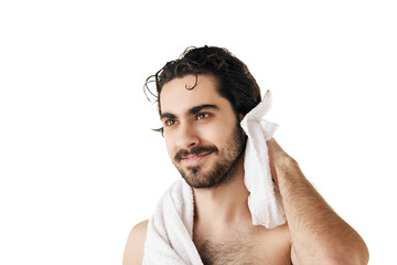 Portrait of attractive man with naked torso drying off after bath treatments with towel against white studio background. Concept of male facial care routine, body care and hygiene. Ad