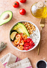 Bowl with rice, shrimp, avocado, tomato, chickpeas and lime. Healthy eating. Diet.