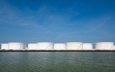 Large crude oil tanks are used to store crude oil, which is a type of unrefined petroleum. Crude oil is a thick, black liquid that is extracted from the ground