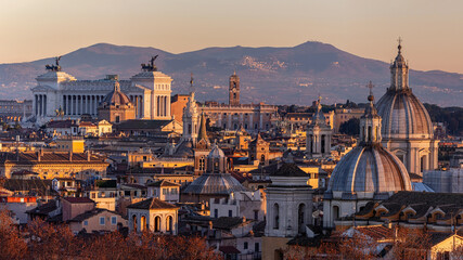 Roof top view of Rome historical center at golden hour. City skyline as seen from Castel...