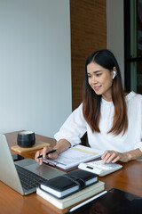 Businesswomen drive online store success together.