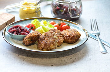 Fototapeta premium a traditional Czech dish of fried meatballs, minced meat with vegetables,