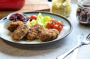a traditional Czech dish of fried meatballs, minced meat with vegetables,