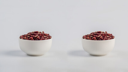 Red kidney beans in white cup on white background
