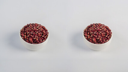 Red kidney beans in white cup on white background