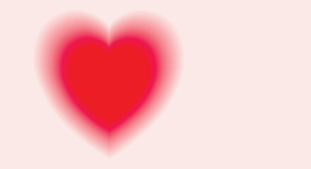 Bright red heart with blurred gradient borders on a pink background. Valentine's Day. Awareness and care concept. Copy space.