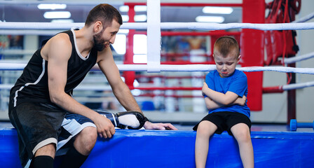 Coach is looking for approach to boy after defeat in boxing ring. Sports psychologist assistance...